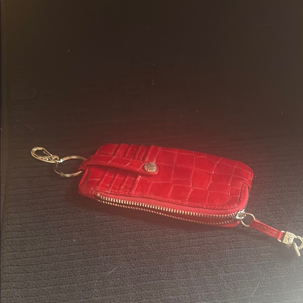 Red patent leather embossed Brighton wallet for on the go.